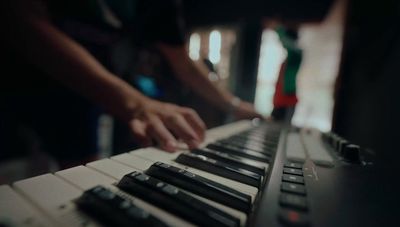 a close up of a person playing a keyboard