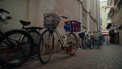 a couple of bikes parked next to a building