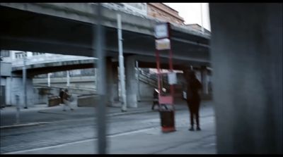 a blurry photo of a person walking down a street