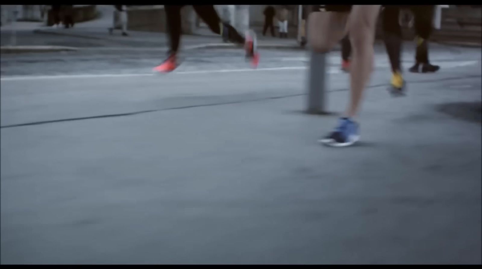 a group of people walking down a street next to each other