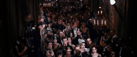 a large group of people standing in a hallway