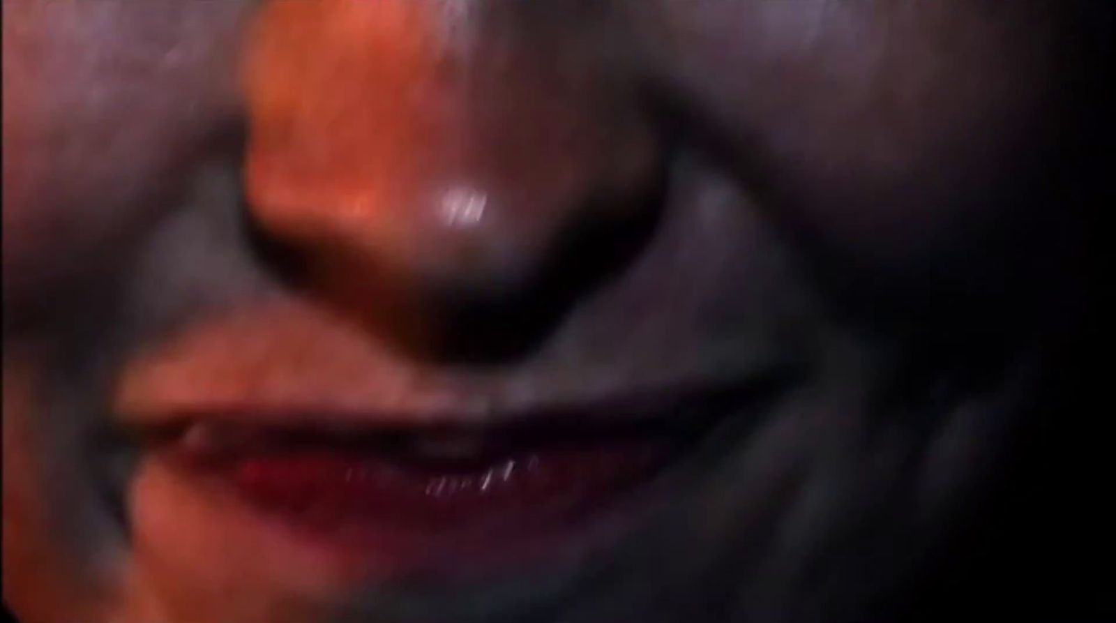 a close up of a person's face with a blurry background