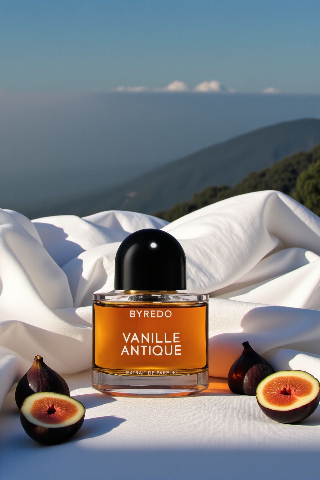 a bottle of perfume sitting on top of a white sheet