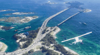 an aerial view of a highway crossing over water