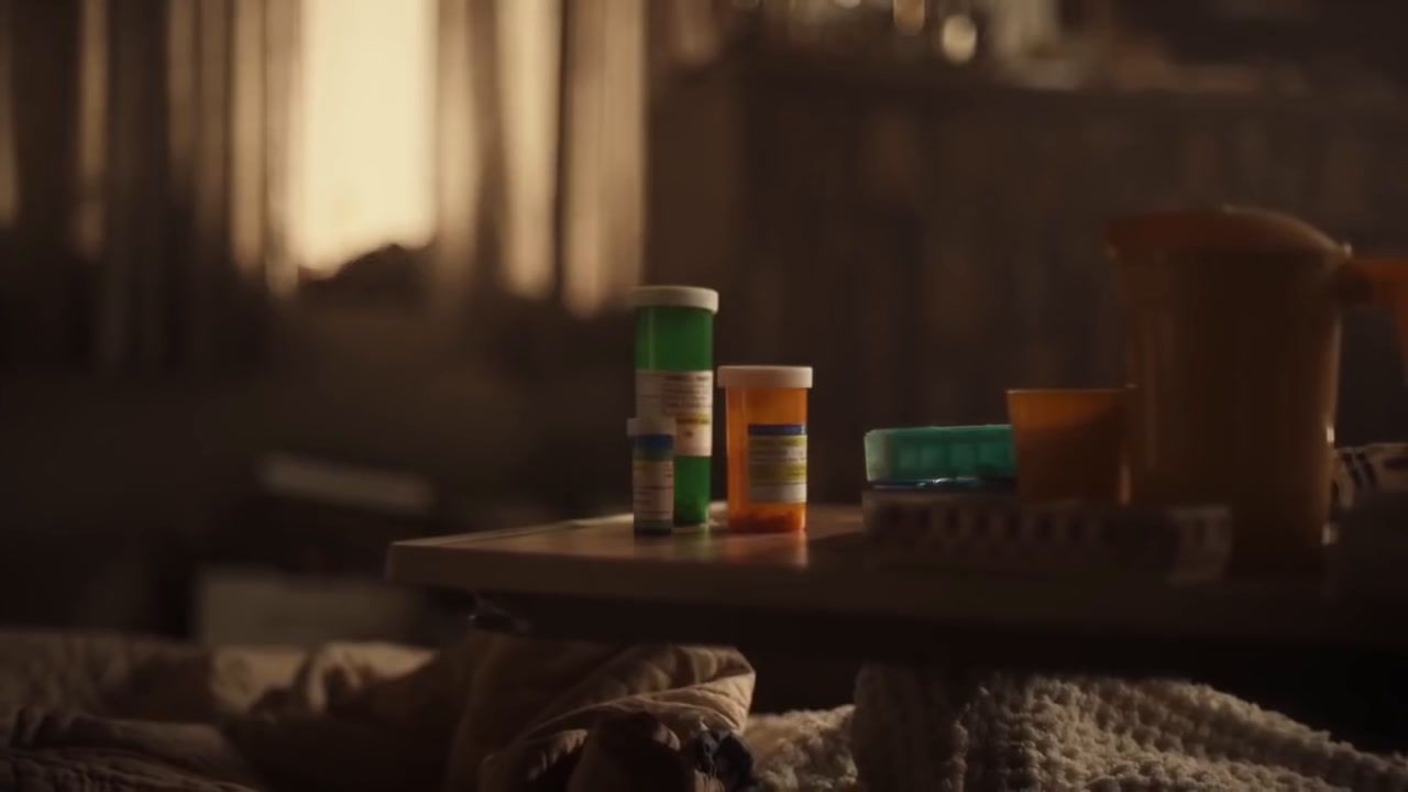 a table topped with lots of bottles of pills