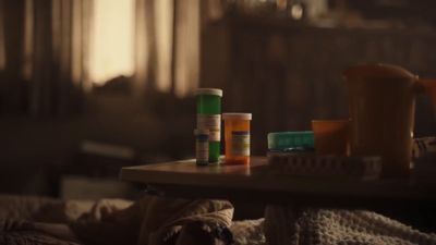 a table topped with lots of bottles of pills