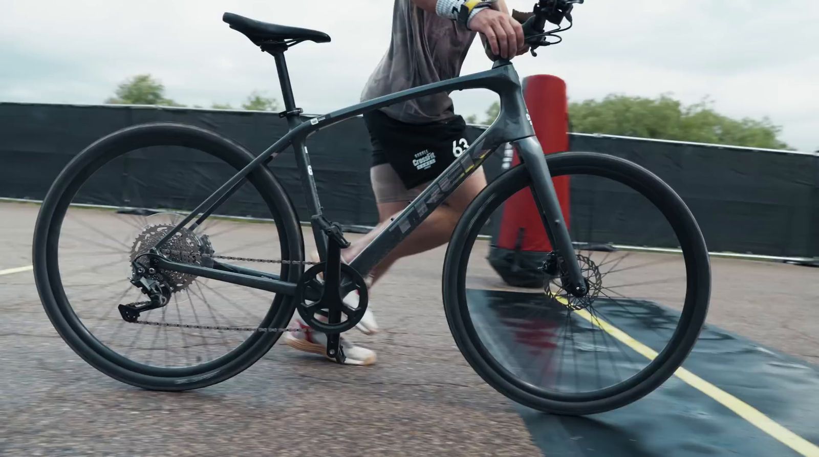 a man riding a bike down a street