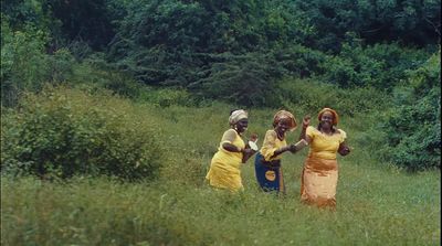 a group of women standing in a field