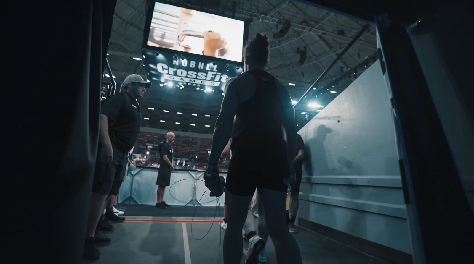 a group of people playing a game on a big screen