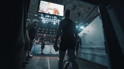 a group of people playing a game on a big screen