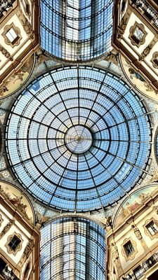 the ceiling of a building with a glass dome