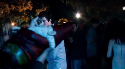 a bride and groom hugging in a crowd of people