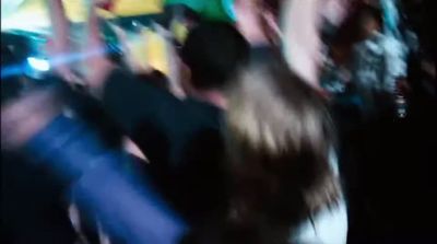 a blurry photo of a group of people dancing