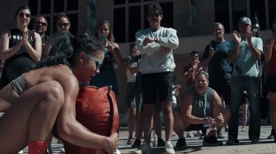 a group of people standing around a fire hydrant