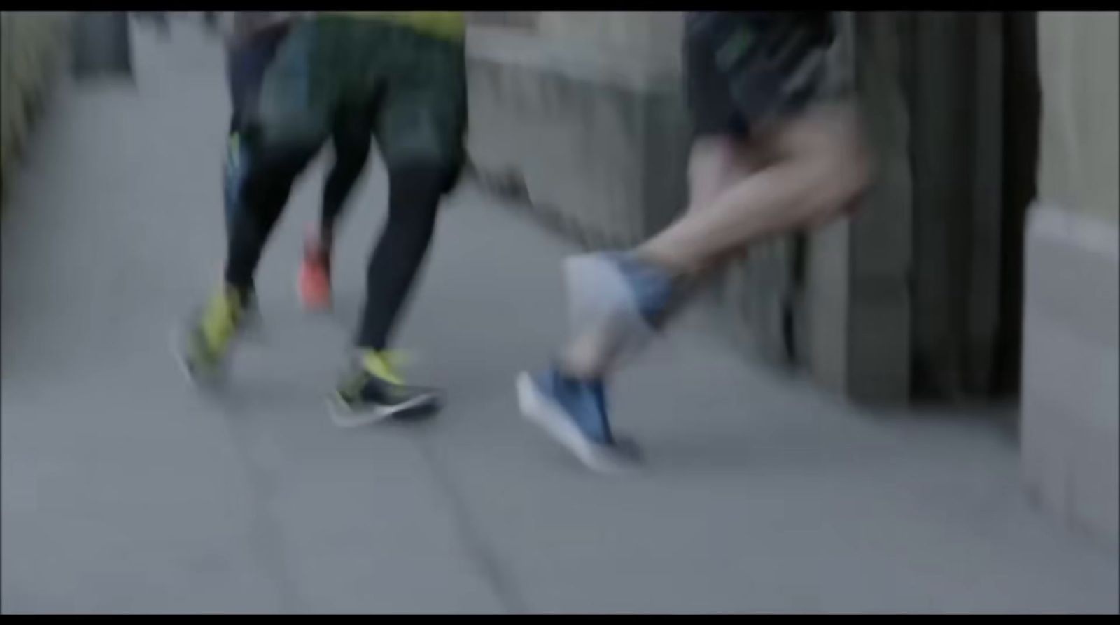 a couple of people that are walking down a street