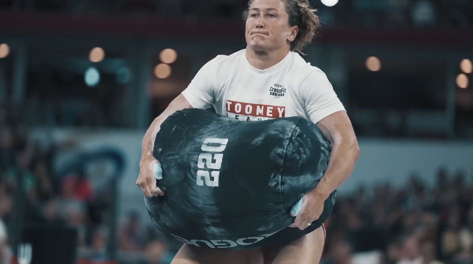 a woman holding a large bag in her hands