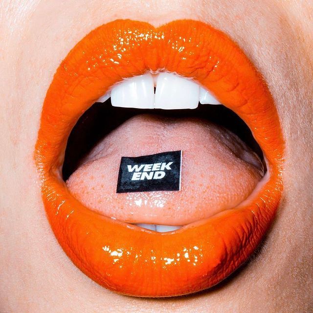 a close up of a person's mouth with a sticker on it