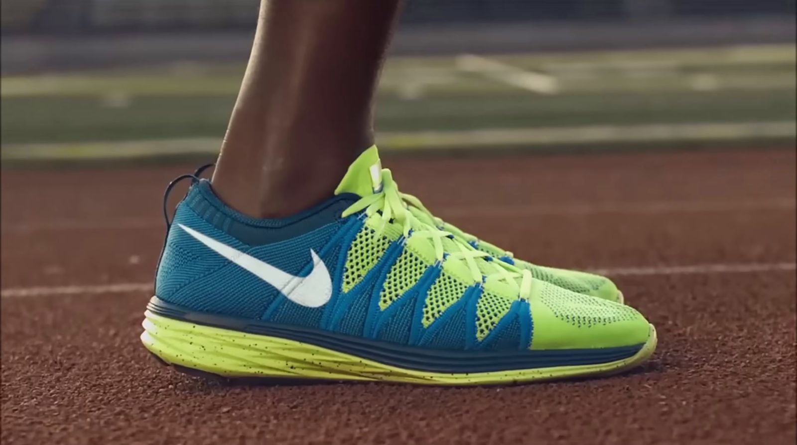 a close up of a person's shoe on a tennis court