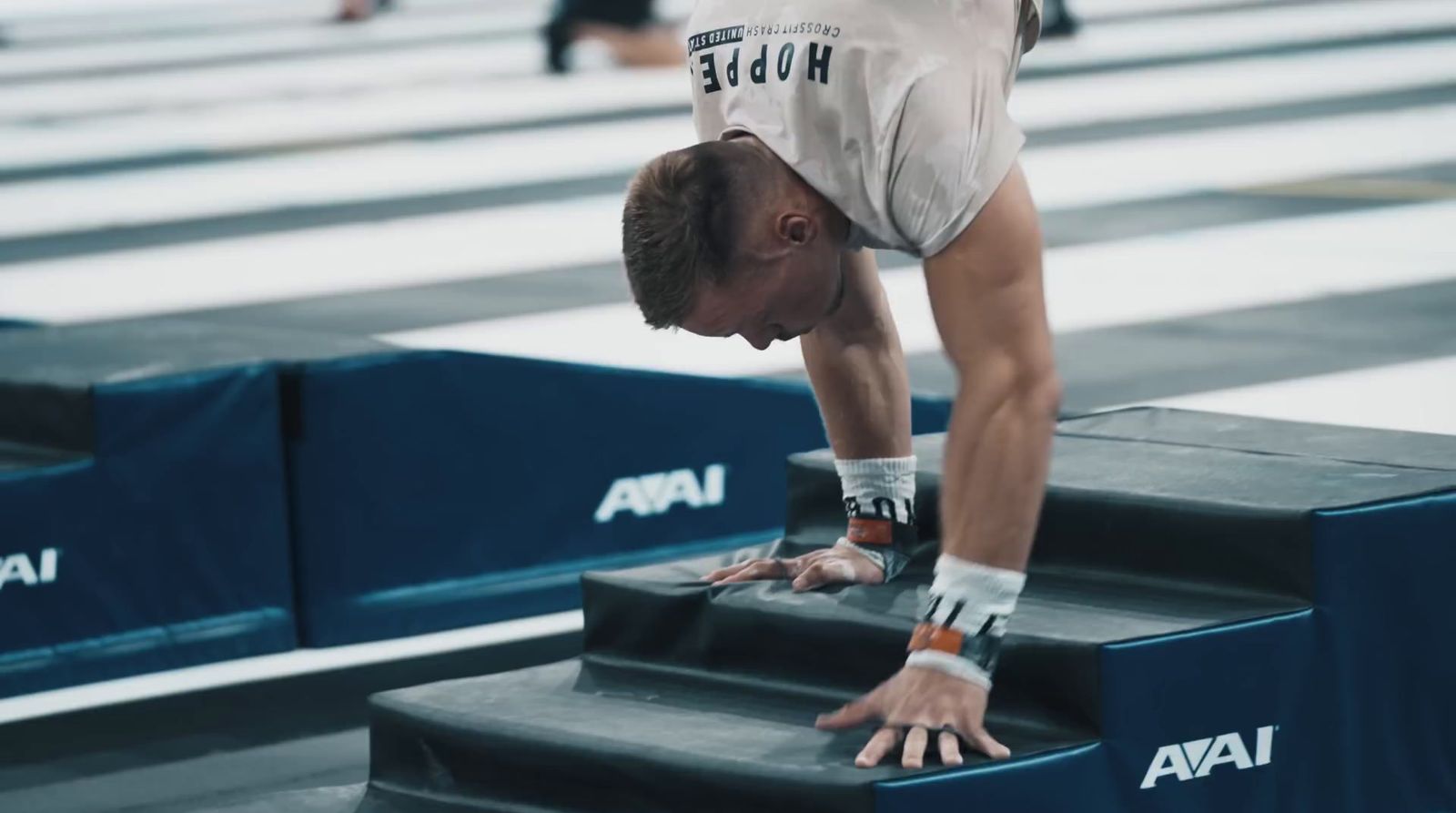 a man doing a handstand on a set of stairs