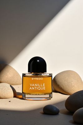 a bottle of perfume sitting on top of a table