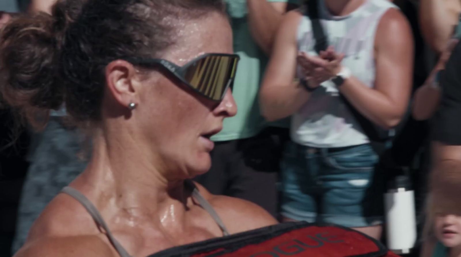 a woman with sun glasses on her face