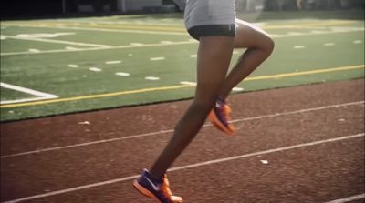 a person jumping in the air on a track