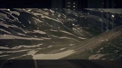 a snow covered mountain with a sky line in the background