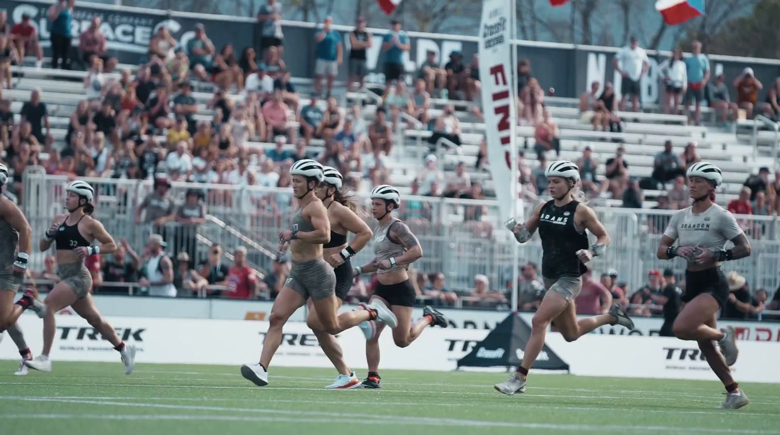 a group of people that are running on a field