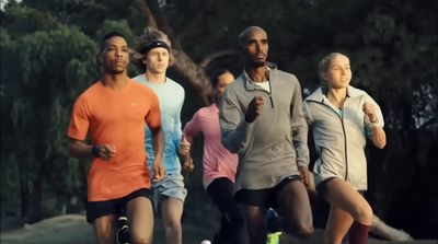 a group of people running in a park