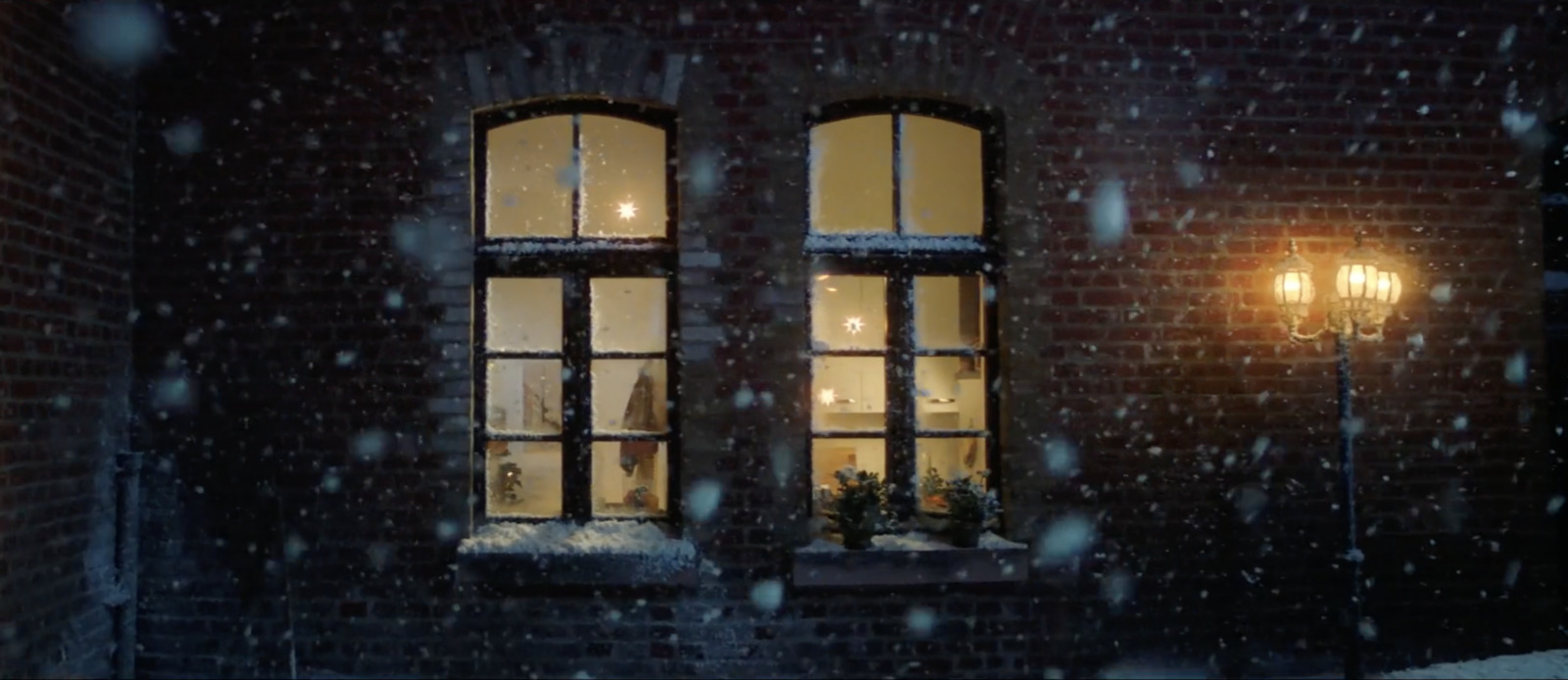 a couple of windows sitting next to a street light