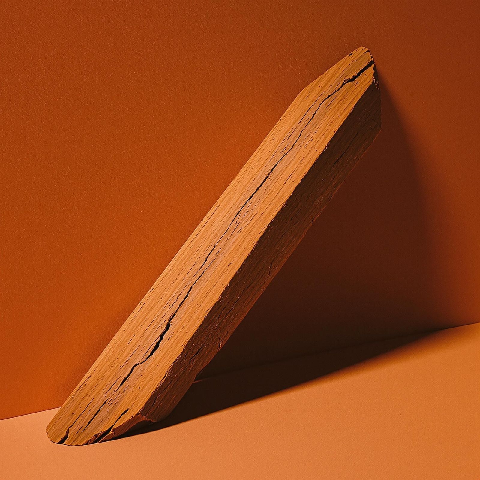 a piece of wood sitting on top of a table