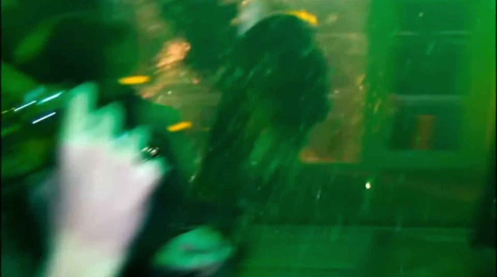 a blurry photo of a person standing in the rain