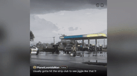 a picture of a gas station on a rainy day