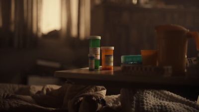 a table topped with lots of bottles of pills