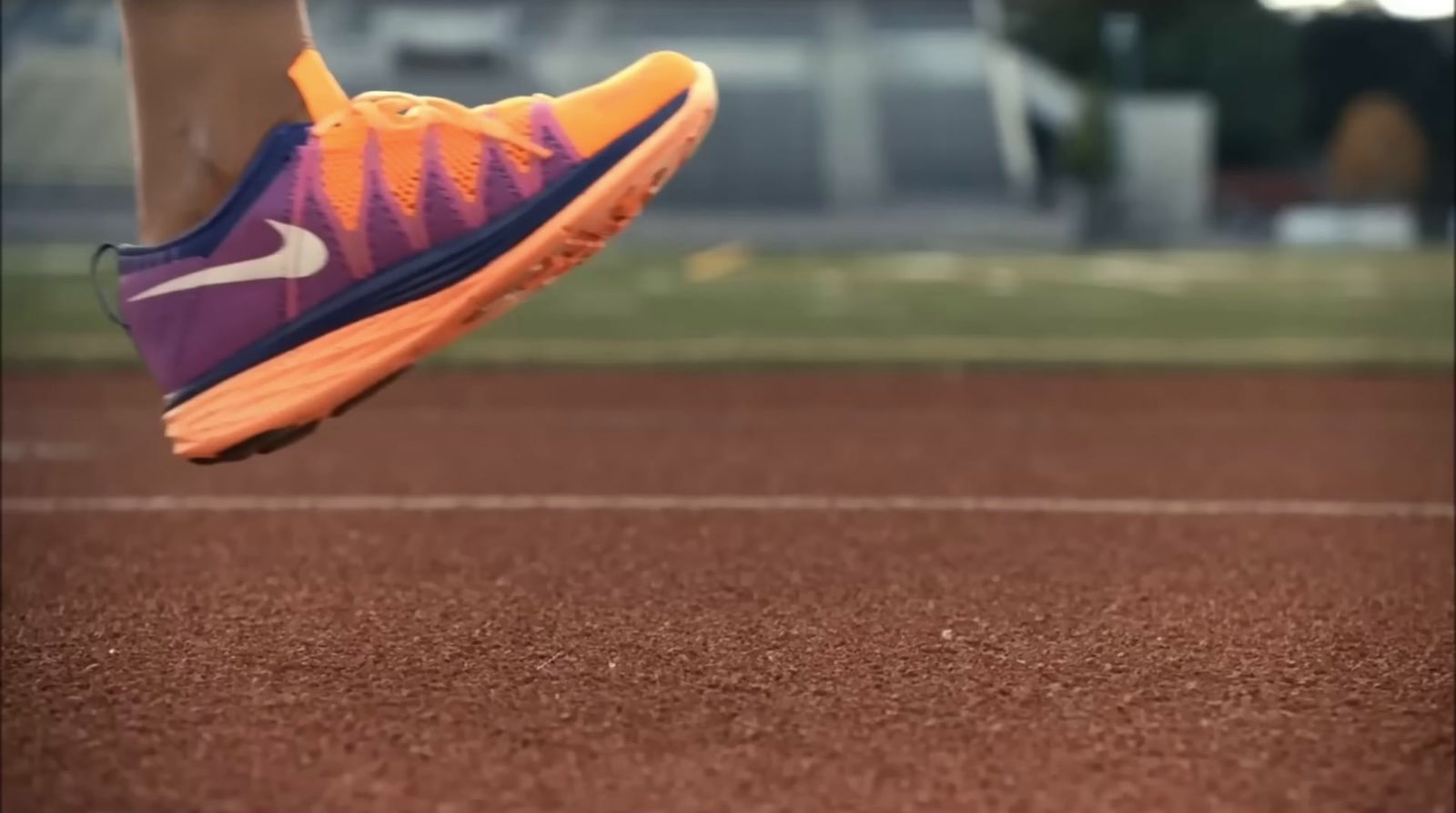 a close up of a person running on a track