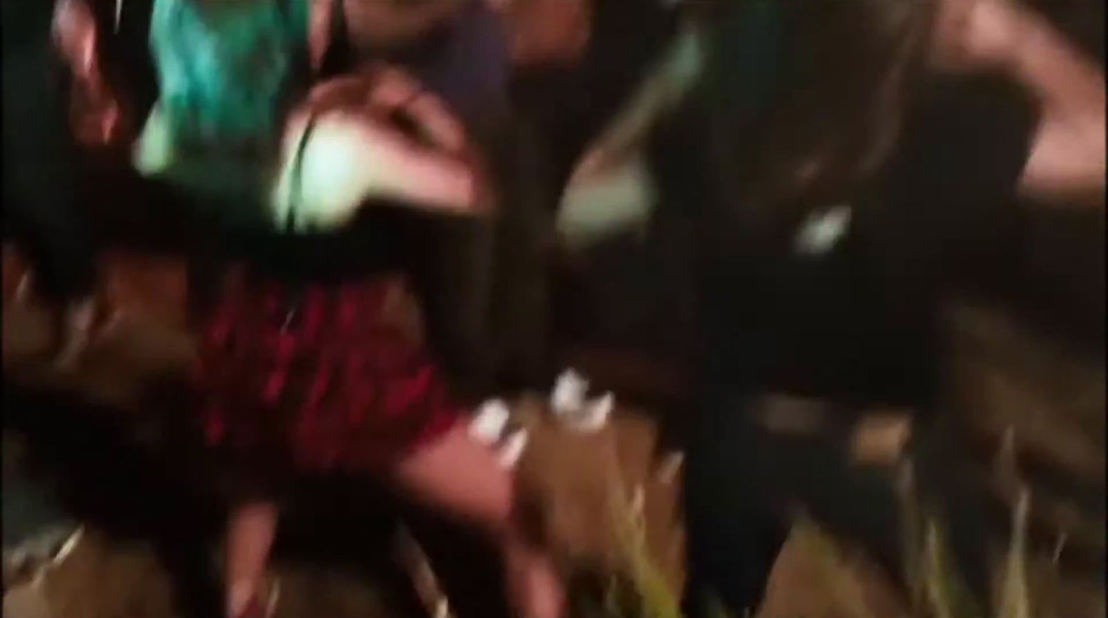 a blurry photo of a group of people dancing