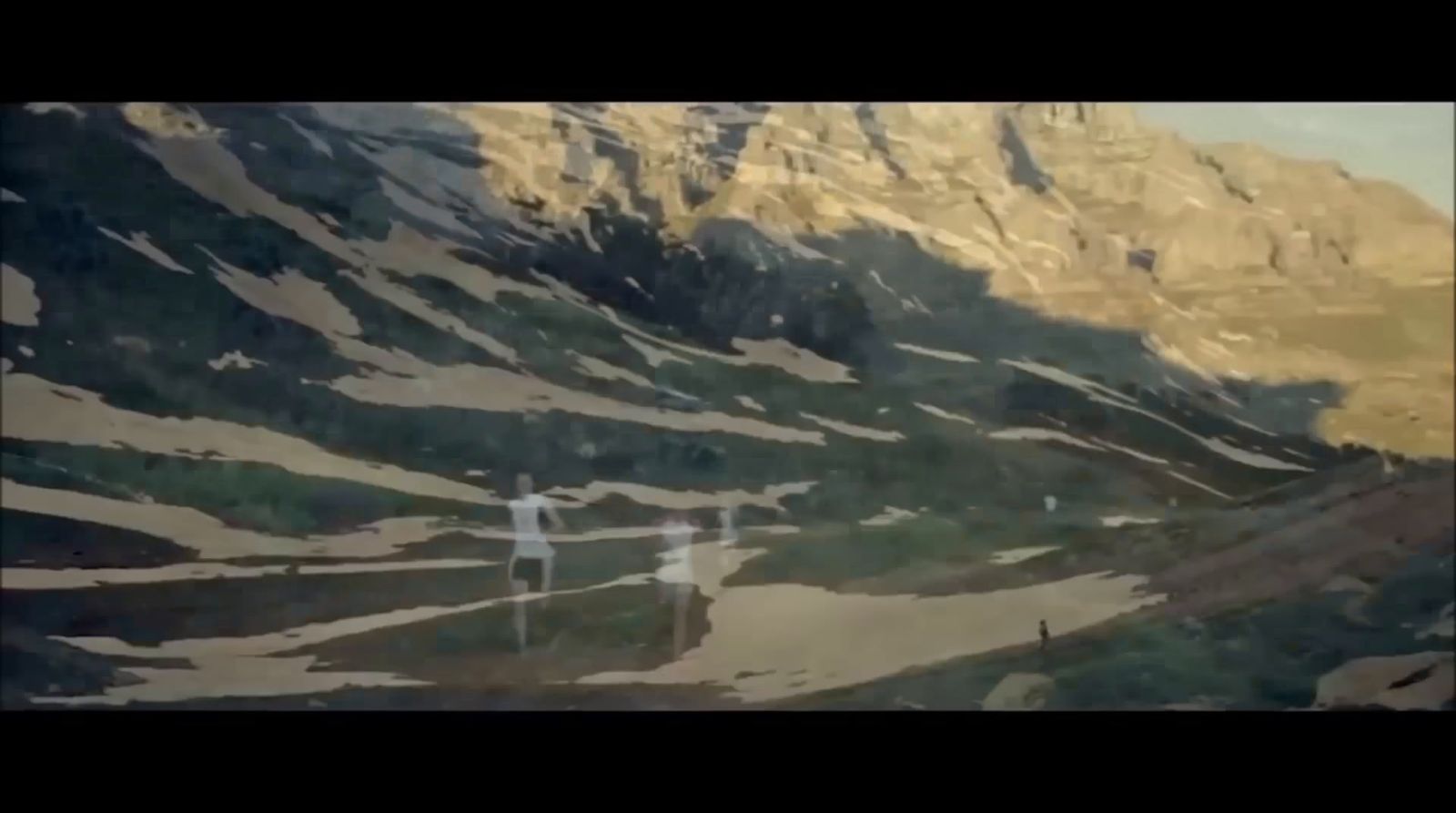 a couple of people standing on top of a snow covered slope