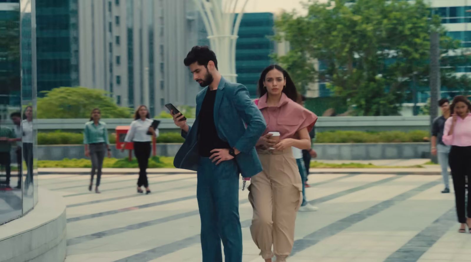a man and a woman walking down a street