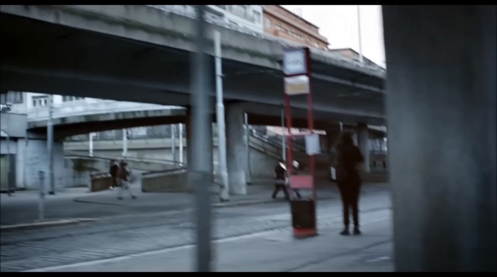 a couple of people walking down a street