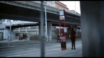 a couple of people walking down a street