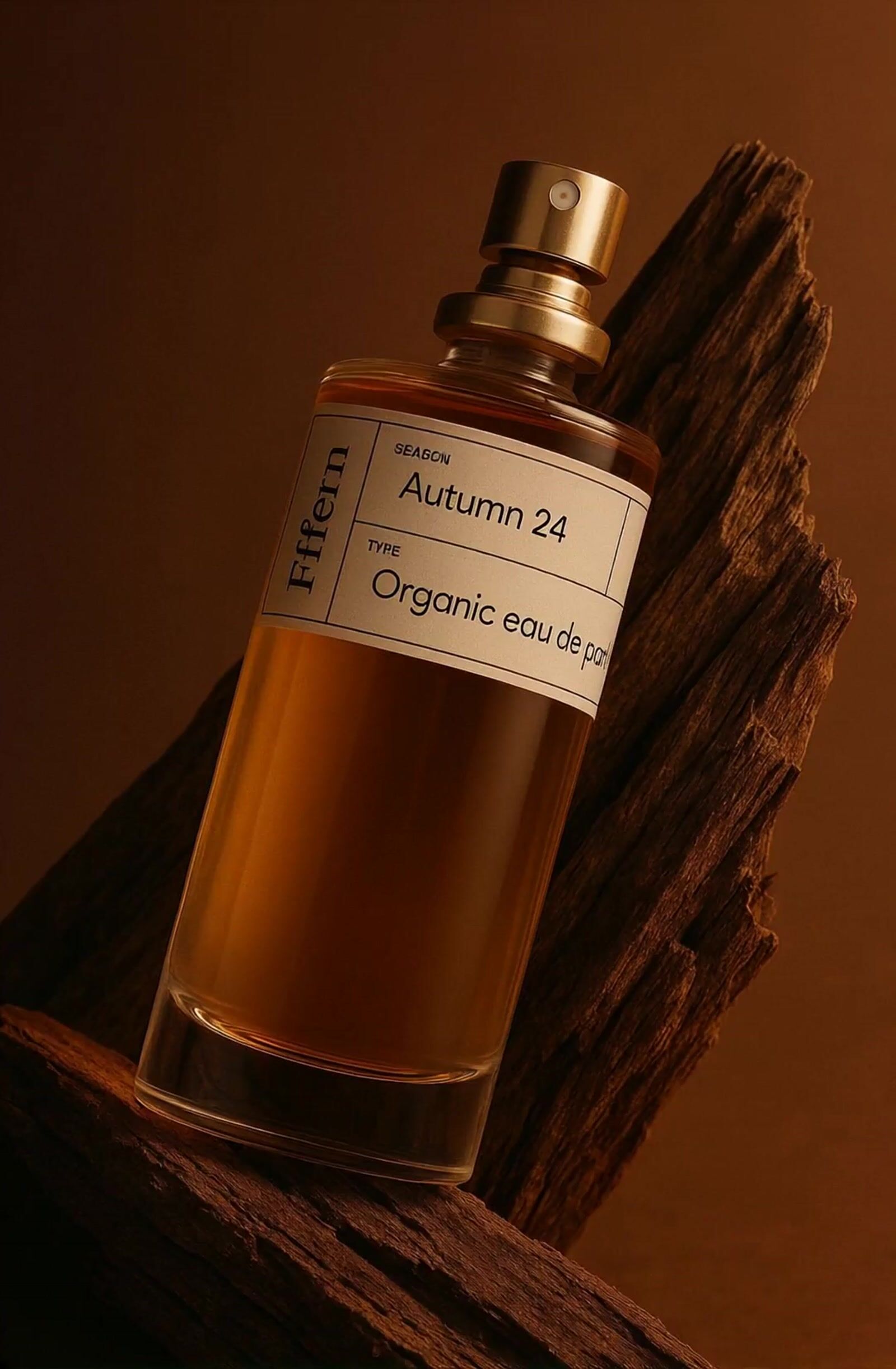 a bottle of perfume sitting on top of a piece of wood