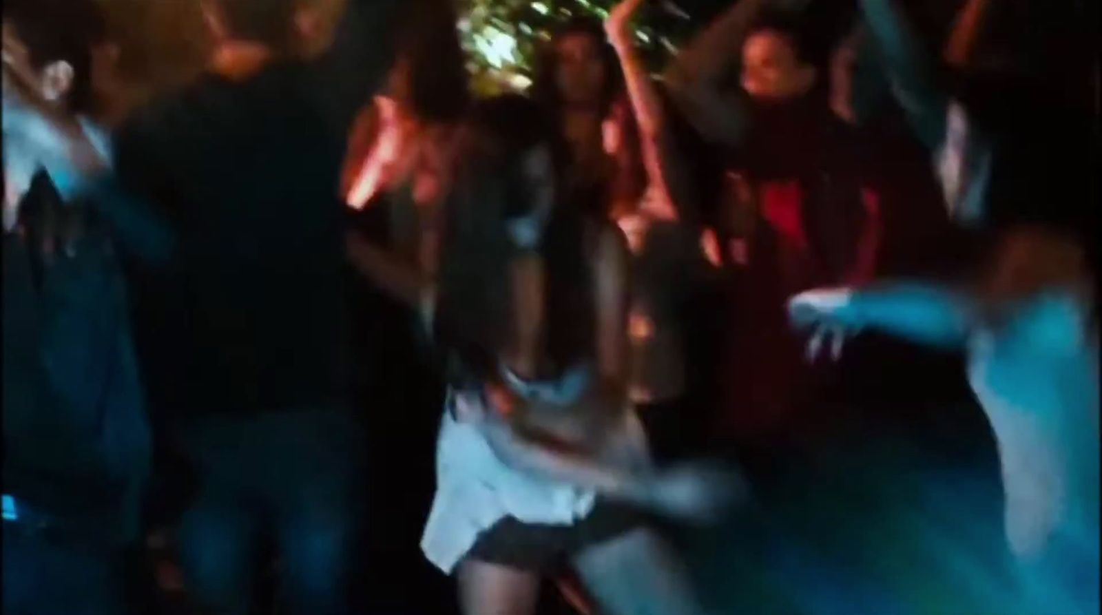 a group of people dancing at a party