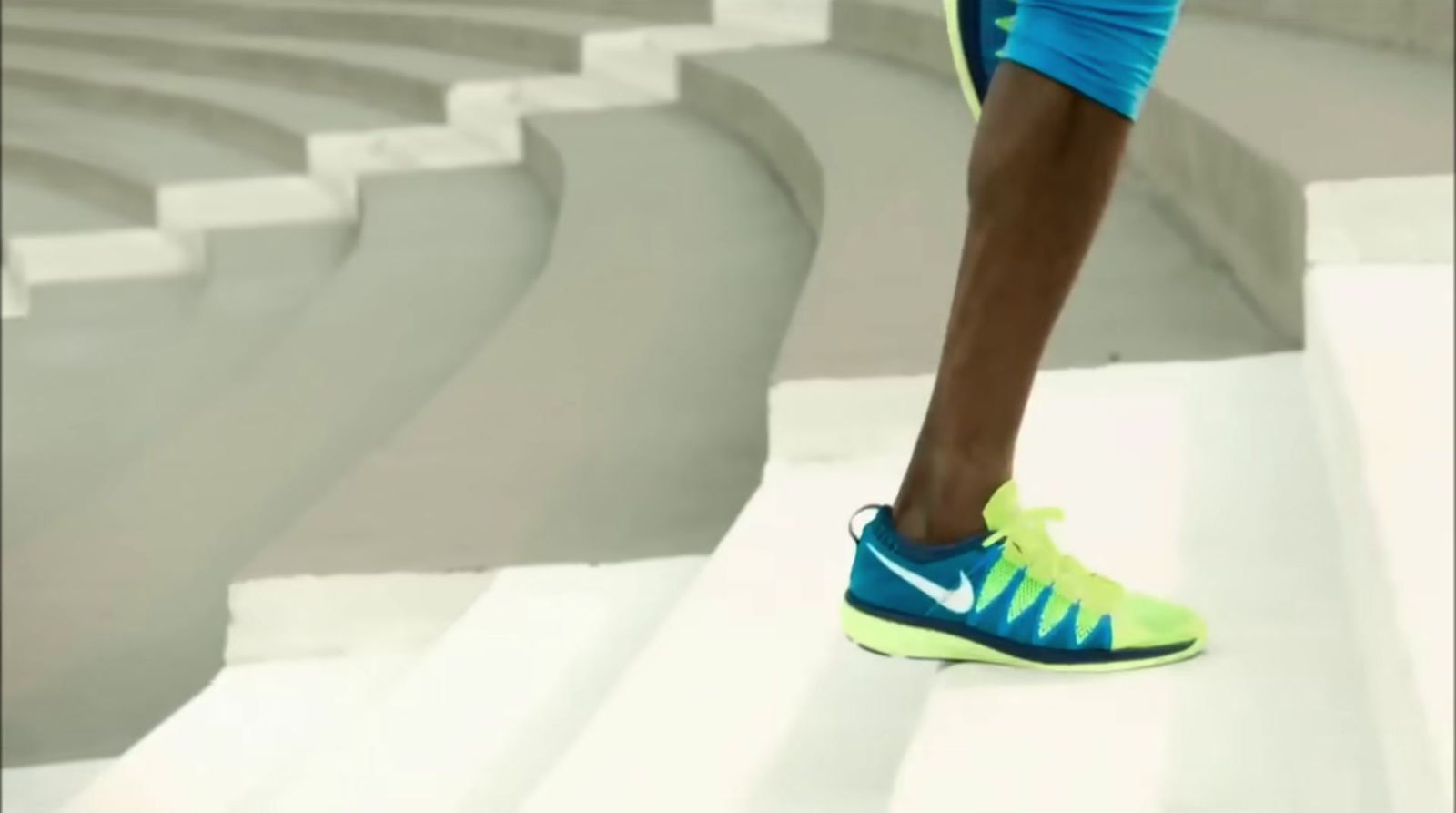 a close up of a tennis player's shoes on the court