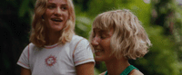 a couple of women standing next to each other