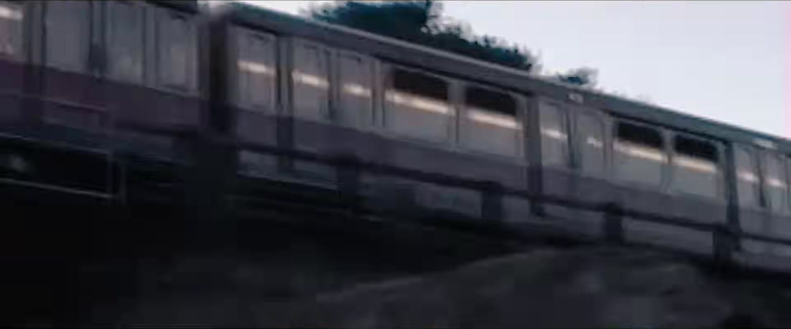 a train traveling over a bridge over a river