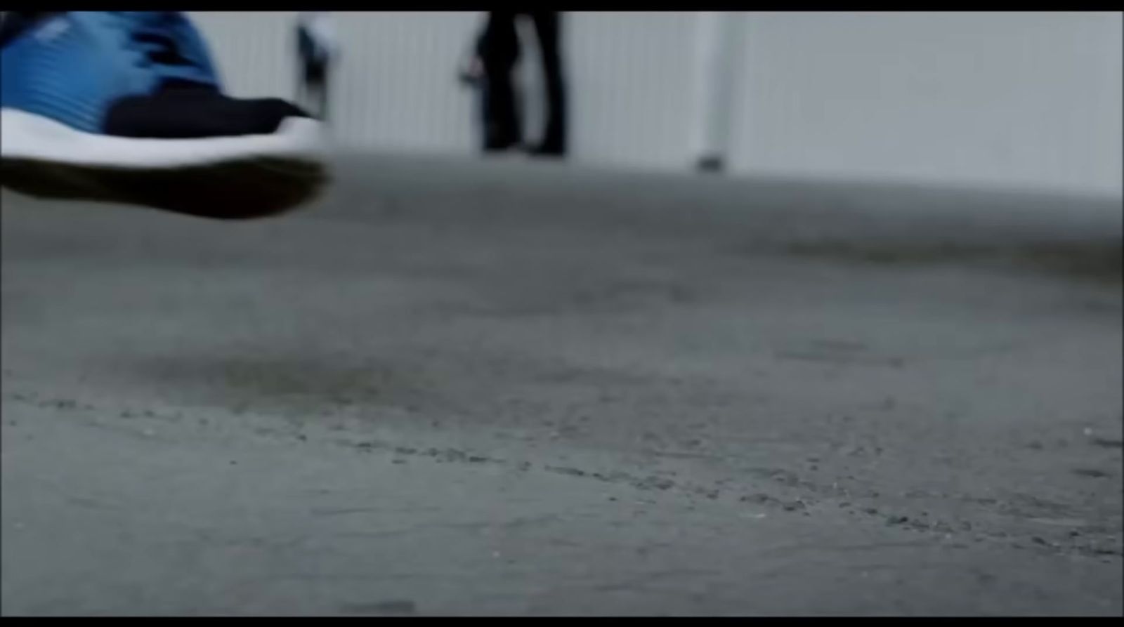 a close up of a person's shoes on the ground