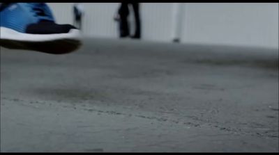 a close up of a person's shoes on the ground