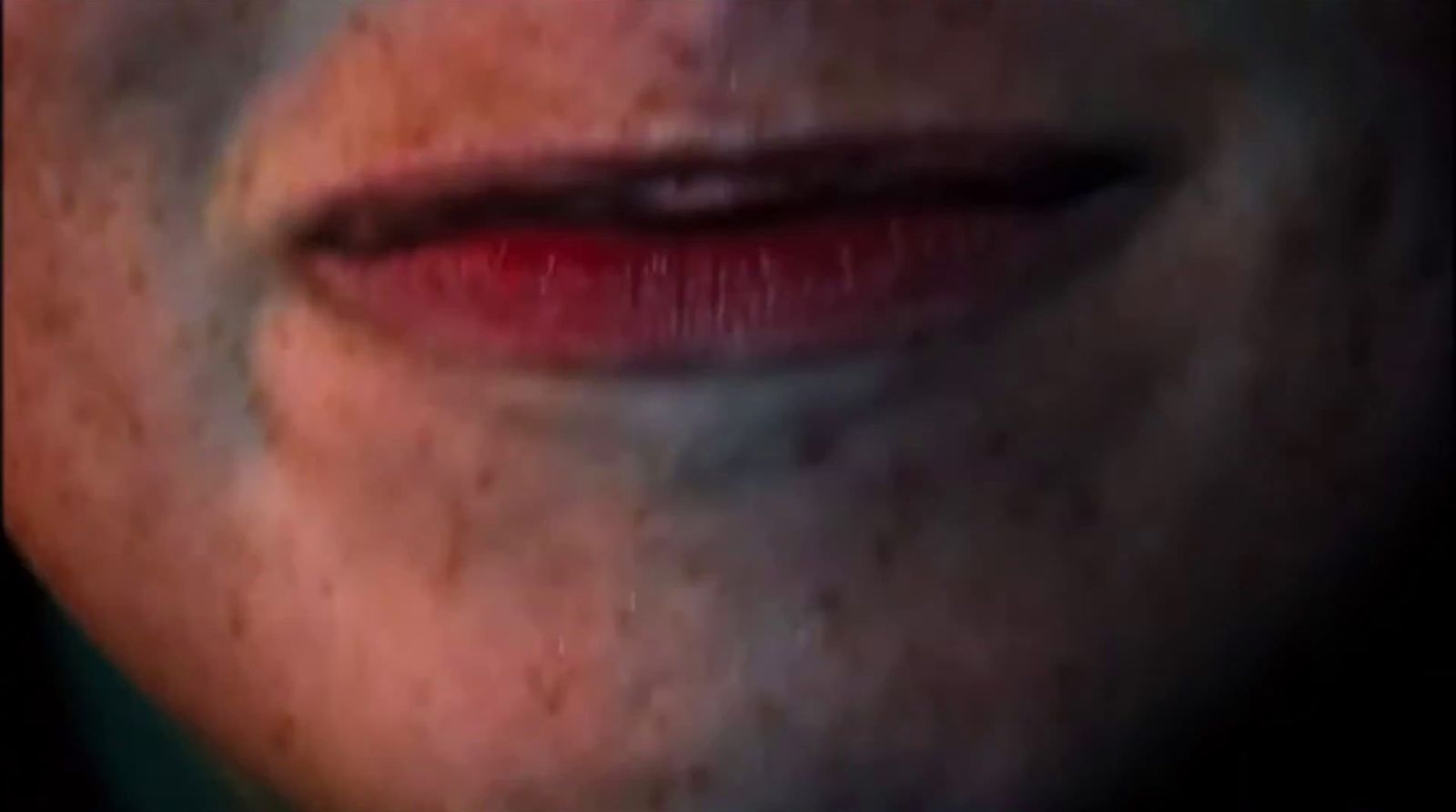 a close up of a person's lips with a blurry background