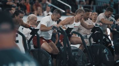 a group of people riding stationary bikes in a gym