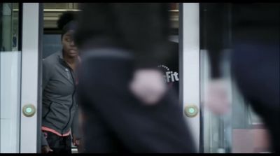 a man standing in front of a glass door